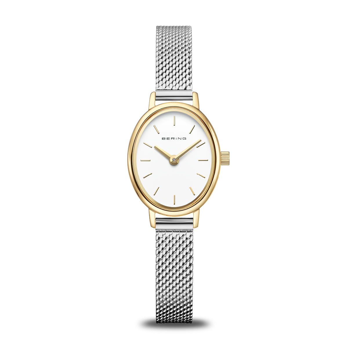 The Bering Watch - Classic Collection 11020-010 is a women's wristwatch featuring a gold oval case, white dial with minimalist gold markers, and a Milanese mesh bracelet. "Bering" is printed on the dial, reflecting timeless Scandinavian design.