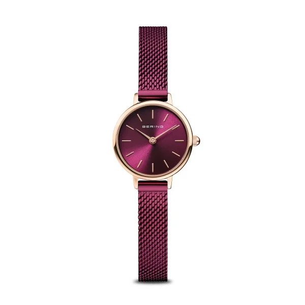 The Bering Watch - Classic Collection Womens Rose Gold w/Purple (11022-969) features a slim purple Milanese strap, round burgundy dial with gold markers, gold case, and the Bering name on the face.