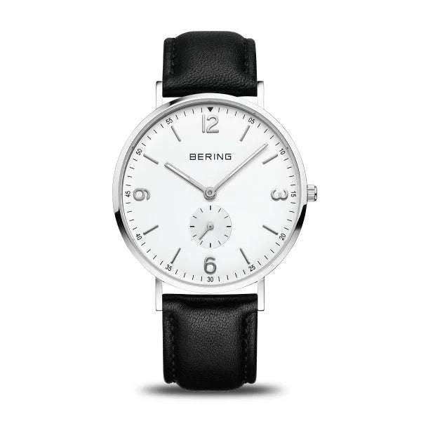 The Bering Watch - Classic Collection 14040-404 features a white dial, silver stainless steel case, black leather strap, minimalist design, bold numerals at 12/3/6/9, and a sleek subdial above 6 o’clock—designed for men by Bering.