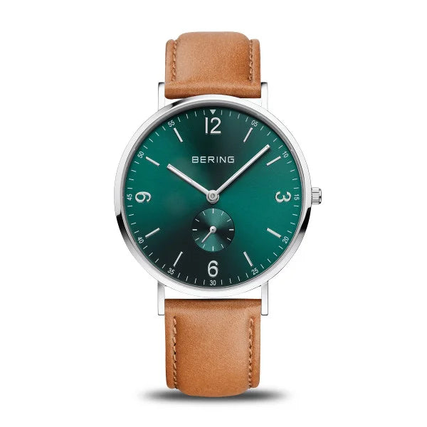 The Bering Watch - Classic Collection - 14040-508 features a green face, silver hour markers, sapphire crystal, small subdial, silver stainless steel case, brown leather strap, and the BERING logo below 12 o’clock.