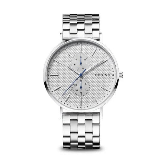 The Bering Watch - Classic Collection Mens Polished Silver (14240-700) features a stainless steel link band, white textured dial, blue and silver hands, day/date subdials, and minimalist hour markers.