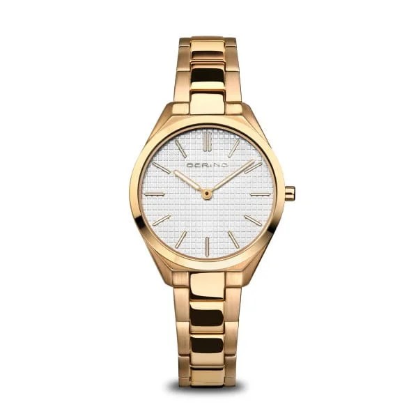 The Bering Watch - Ultra Slim Womens Gold (17231-734) features Danish design, a sleek linked metal band, and a round white textured face with gold markers and hands. The Bering name is below the 12 oclock position.