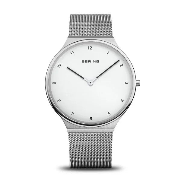 The Bering Watch - Ultra Slim Womens Silver (18440-004) by Bering features minimalist Danish design with a silver mesh band, white face, black hour markers, slim silver hands, sapphire crystal, and clean lines.