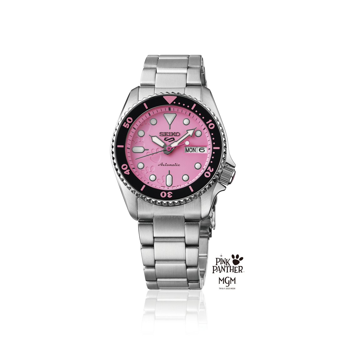 The Seiko 5 Pink Panther Limited Edition (SRPM07) wristwatch features a pink dial, black and pink bezel, silver hour markers, and the MGM logos, displayed upright with a metal bracelet. Brand: Seiko.
