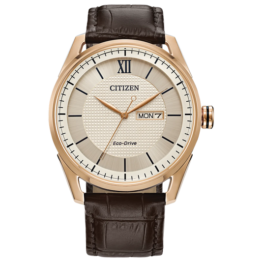 The Citizen Watch - Classic - AW0082-01A by Citizen features a rose gold-tone case, white textured dial with black Roman numerals/indices, day/date display, and a brown leather strap.