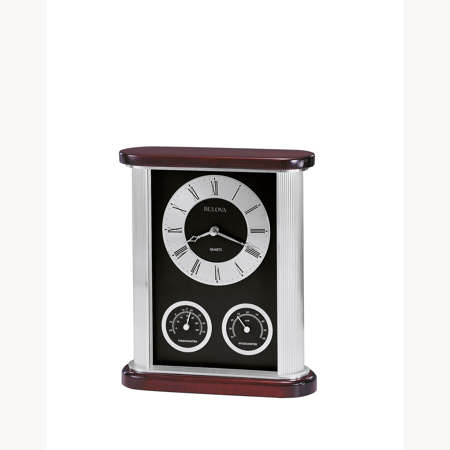The Bulova Clock Belvedere B7590 is a rectangular timepiece with a classic round face, Roman numerals, dual temperature and humidity dials, and a black and silver case accented with rich mahogany.