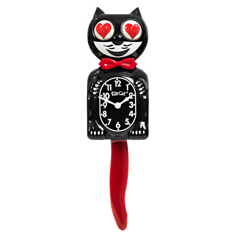 The California Clocks Kit-Cat Klock - Crimson Royale (Limited Edition, BC-1CR-Heart Eyes) has a black cat shape, heart eyes, red bow tie and tail, and a clock face with white numbers/hands on the body.