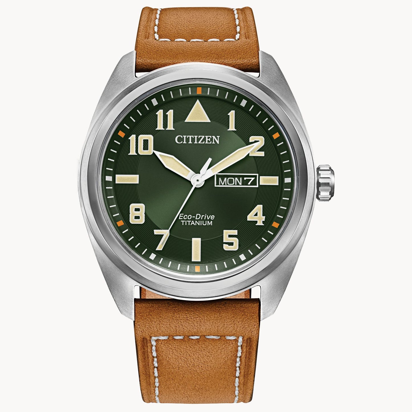 The Citizen Garrison Super Titanium (BM8560-02X) watch by Citizen features a green dial, luminous hands and markers, day-date display at 3 o’clock, and a brown leather strap with white stitching.