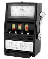 The Sanis Enterprises Sanis Mini Clock – Slot Machine (C3298) is a black, slot machine-shaped mini clock featuring three spinning reels with cherries, a side lever, and a time display at the top.