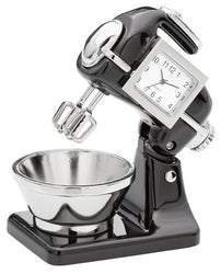 The Sanis Enterprises Sanis Mini Clock - Black Mixer - CK135BK is a stylish stand mixer-themed clock with a mixing bowl and a mini clock embedded in the head where the motor would be.