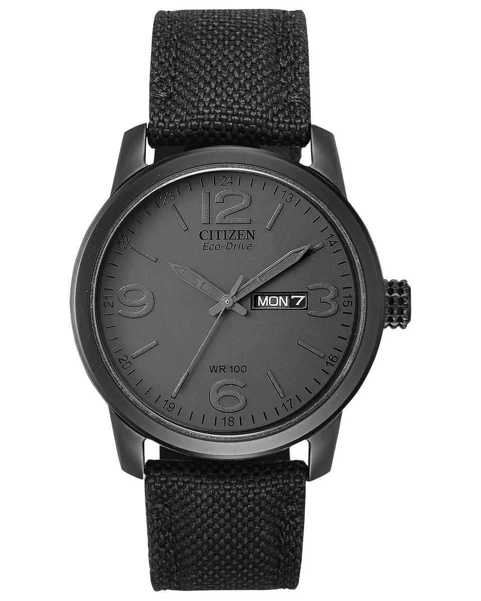 The Citizen Watch - Chandler - BM8475-00F features a black fabric strap, monochrome black dial, silver-tone hands, Arabic numerals, and a day-date display at 3 o’clock for rugged military-inspired style.