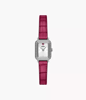 The Fossil Raquel Mini ES5466 watch features a rectangular silver case, a white dial with a pink heart at 12 o’clock, sparkling crystals, and a stylish pink leather strap for added charm.