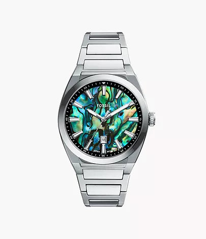 The Fossil Everett FS6114 watch features a vibrant abalone shell dial with a date display at 6 o’clock, stainless steel case and bracelet, and minimalist hour markers for a sleek, modern style.