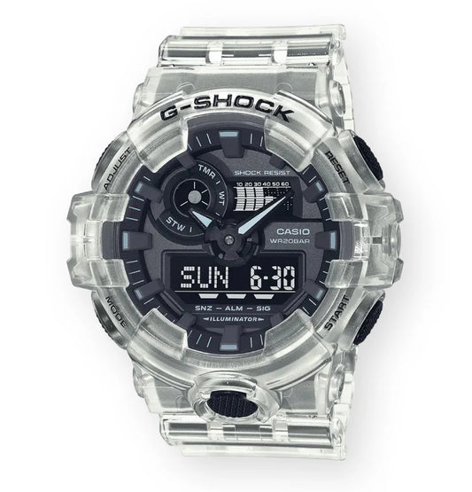 The VLC Distribution Co. Casio G-Shock Watch - Skeleton Series - GA700SKE-7A features a transparent resin band and case, bold G-SHOCK text, and a black dial with both analog and digital displays for time and functions.