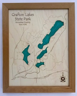 The Lake Art "Grafton Lakes - Laser Carved Wooden Relief Map" (11"x14") features an engraved map of Grafton Lakes State Park, NY with blue lakes, detailed roads and trails, and a north compass rose—all elegantly framed.