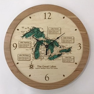 The Lake Art Lake Clock - Great Lakes Map Clock has a round wooden design, engraved map with labeled lake sections, and black hands. Hours 12, 3, 6, and 9 are marked—ideal for custom lake clock fans.