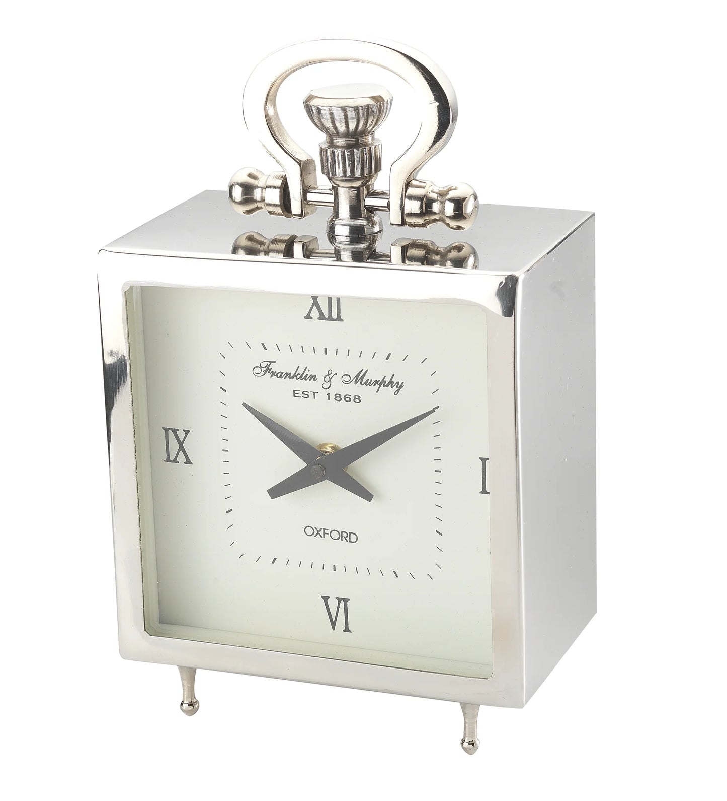 The A Sanoma Steel/Aluminum Small Tabletop Clock (KG502) features a silver rectangular design, white face, black Roman numerals and hands, a decorative handle, small legs, and Franklin & Murphy EST 1868 OXFORD labeling.