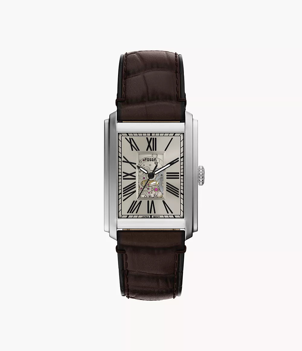 The Fossil Watch - Carraway - ME3272 by Fossil features a rectangular silver case, brown leather strap, Roman numeral markers, and a partially open dial showcasing the automatic movement. Shot against a plain white background.