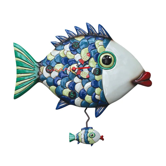 The Enesco Allen Designs Fishy Lips Clock (P1766) features a fish-shaped pendulum with blue, green, and yellow scales, red lips, fish bone-shaped hands, and a swinging mini fish—perfect for vibrant nautical decor.