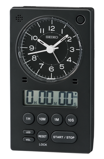 The Seiko Clock - Tokai Alarm - QHE190KLH is a black Seiko alarm clock with an analog clock face, digital timer display, round control buttons for settings, and quartz movement.