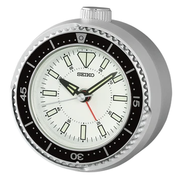 The Seiko Clocks - Heritage Design - QHE207SLH features a round white face, black outer ring, bold hour markers, three hands with a quiet sweep second hand, and a classic silver bezel—all reflecting Seiko’s timeless heritage style.
