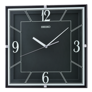 The Seiko Clock - Lanvin 11 Wall Clock (QXA821K) features a square black face, white hour and minute hands, bold white numerals at 12, 3, 6, and 9, a quiet sweep second hand, and displays the time as about 10:10.