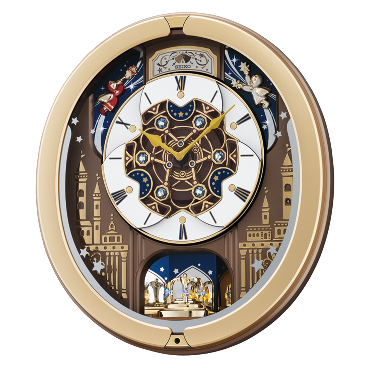 The Seiko Clocks Skyline Melodies In Motion Clock (QXM350G) features a decorative face with gold and brown accents, Roman numerals, star patterns, two small figurines, and a rotating gold-toned musical display.