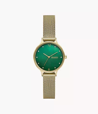 The Fossil Skagen Watch - Anita Lille (SKW3145) showcases a green dial, minimalist gold hour markers, and a sleek gold mesh bracelet, with the Skagen logo elegantly displayed on the face.