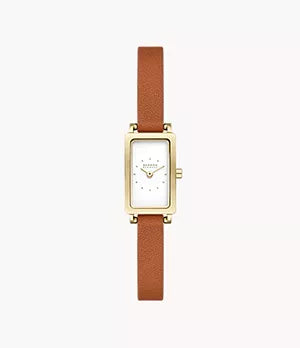 The Fossil Skagen Watch - Hagen Micro (SKW3149), featuring a gold-tone rectangular case, white dial, minimalist design, and brown leather strap, is displayed on a plain white background.