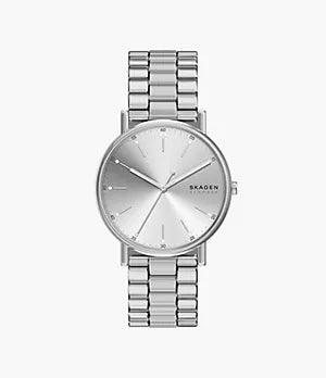 Introducing the Skagen Watch - Signatur - SKW6950 by Fossil, a stainless steel timepiece with a sleek silver dial, metallic band, and minimalist face featuring slender hour markers and hands—an embodiment of modern elegance.