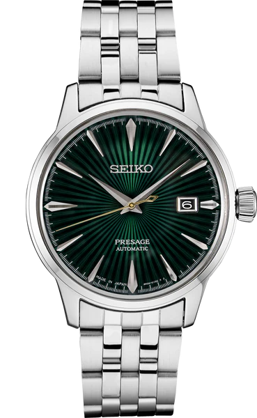 The Seiko Watch - Presage Cocktail Time - SRPE15 features a silver metal band, striking green dial, silver hour markers and hands, plus a date window at 3 o’clock—a standout Japanese mechanical watch by Seiko.