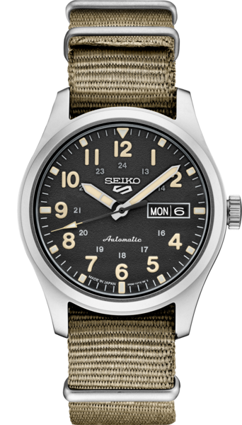 The Seiko SRPG35 menβs watch from the Seiko 5 Sports line features a khaki fabric strap, black dial with beige numerals, white hands, and displays time, day, and date. The dial has "Seiko" and "Automatic" printed on it.