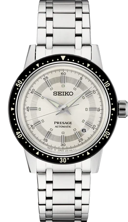 The Seiko SRPK61 Limited Edition Presage is an automatic watch with a white dial, black bezel with minute markers, silver hour markers and hands, date at 3 o'clock, and a stainless steel link bracelet.