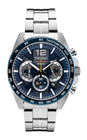 The Seiko Watch - Essentials - SSB345 is a men's silver chronograph with a blue dial, three subdials, tachymeter bezel, stainless steel link band, and analog display featuring silver and orange accents.