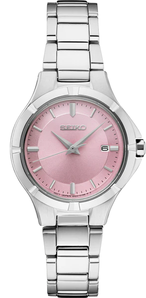 The Seiko Essentials SUR413 is a silver watch with a pink sunray dial, stainless steel bracelet, date display at 3 o’clock, and silver hour markers and hands.