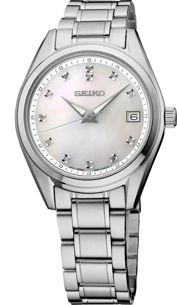The Seiko Diamond Collection SUR579 watch features a stainless steel band, white mother-of-pearl dial, diamond hour markers, silver hands, and a date display at 3 o'clock.