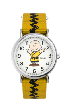 The Timex Peanuts Weekender (TW2R41100JT) watch features Charlie Brown on the face, a yellow and black zigzag fabric strap, bold black numbers on white, and character arms as hands. Brand: Timex.