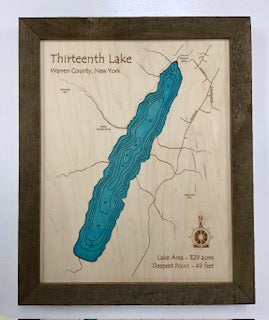 The Lake Art Lake Map of Thirteenth Lake (11" x 14") is a laser-carved wooden relief showing contour lines, roads, compass rose, 329-acre area, and 49-ft depth in Warren County, NY.