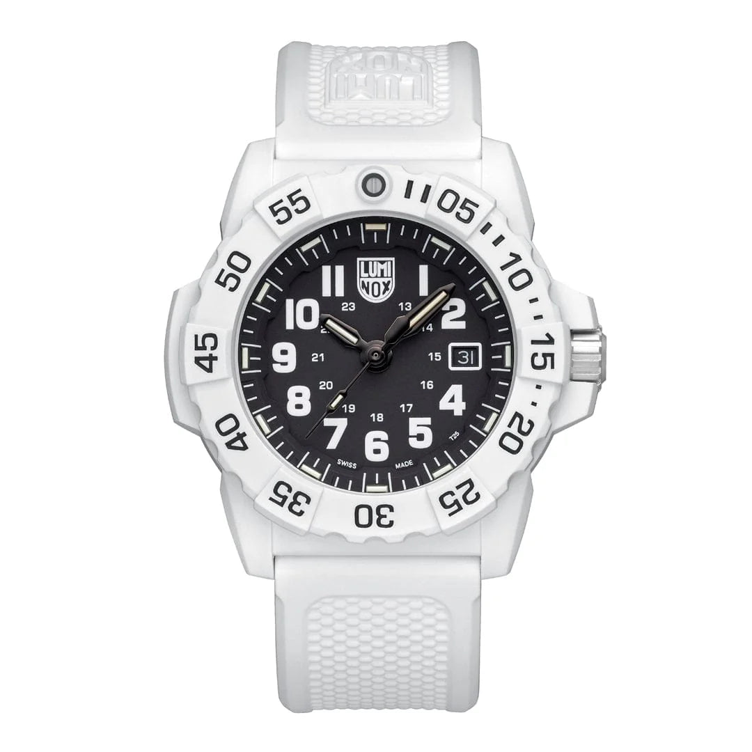 The Luminox Navy SEAL 3500 XS.3507.WB features a white textured strap, black dial with white numerals, date display, rotating bezel with minute markers, and luminescent hands powered by Luminox Light Technology.