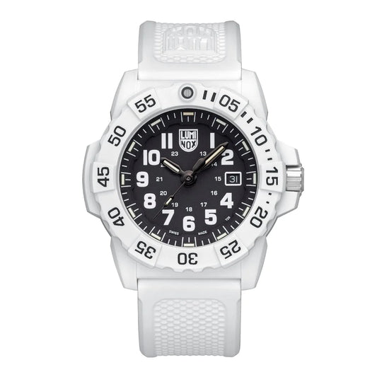 The Luminox Navy SEAL 3500 XS.3507.WB features a white textured strap, black dial with white numerals, date display, rotating bezel with minute markers, and luminescent hands powered by Luminox Light Technology.