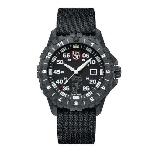 The Luminox F-117 Nighthawk XA.6442.H aviator watch features a black fabric strap, bold white numerals and hands, a date window at 3 o’clock, and a rugged black bezel with minute markers.