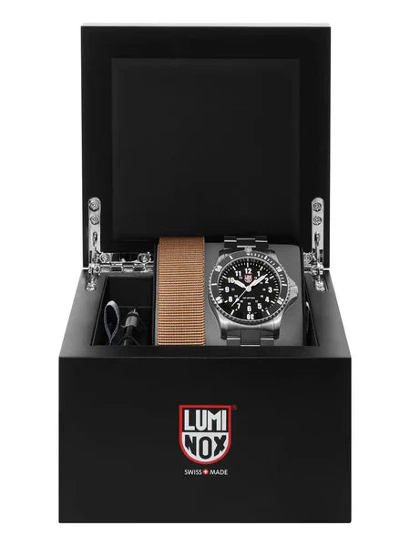 The Luminox Watch - 30th Limited Edition - XS.0901.30TH is presented in an open black box with the Luminox logo, featuring a water-resistant black-dial watch, tan fabric strap, and tool.