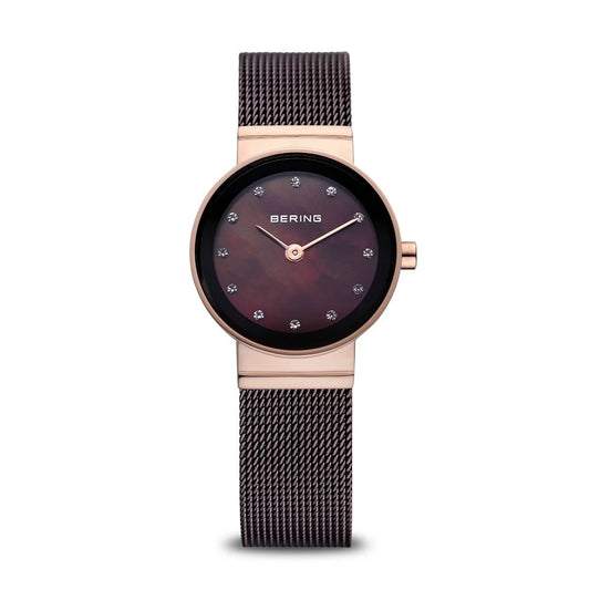 The Bering Watch - Polished Rose Gold - 10122-265 features a rose gold case, black milanese strap, dark burgundy dial, crystal hour markers, and slim hands—a stylish accessory from Bering.