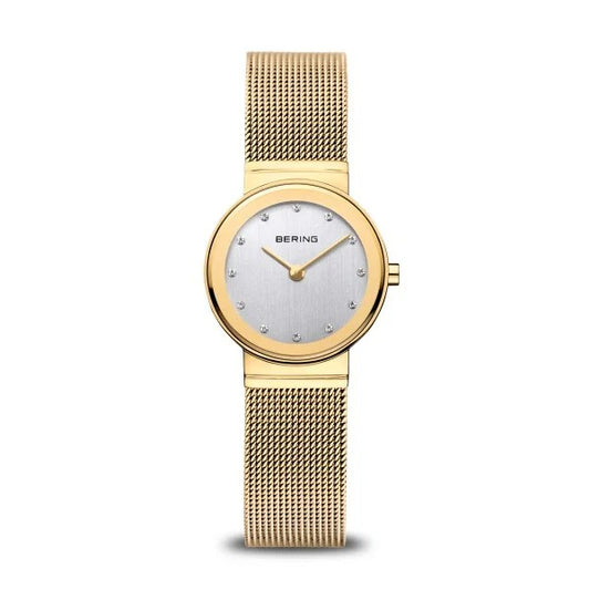 The Bering Watch - Slim Classics Collection Womens Gold 10126-334 features a gold mesh strap, round silver dial, crystal hour markers, and thin gold hands for a minimalist look.