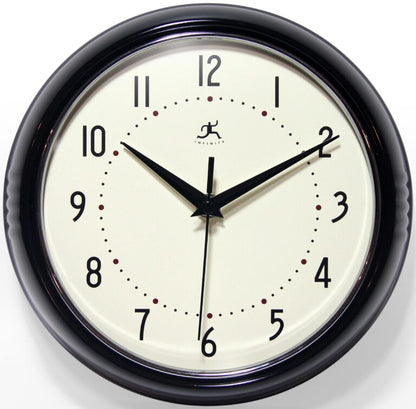 The Infinity Instruments Retro Black Clock (10940 BLK) features a white face, bold black numbers, red hour dots, and sleek black hands showing 10:10:31—all in a classic style.