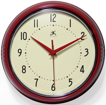 The Infinity Instruments - Retro Red Clock - 10940 RED by Infinity features a round red frame, cream face, bold black numbers, and red hands displaying 10:10:09—combining vintage charm with reliable timekeeping.