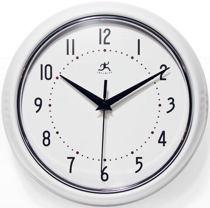The Infinity Instruments Retro White Clock (10940 WHT) by Infinity features bold black numbers, black hour/minute/second hands, a silent movement, and a sleek modern design—showing 10:10:30 and bringing calm to any space.