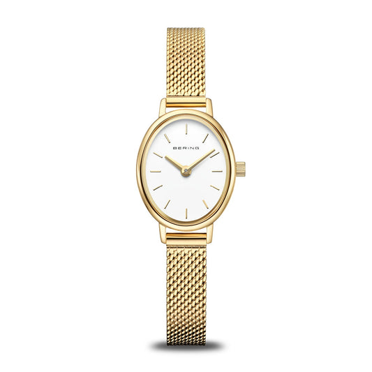 The Bering Watch - Classic Collection - 11020-334 is a women's gold watch with a gold mesh band, oval white dial, minimal gold hour markers, elegant gold hands, and the Bering name on the face.