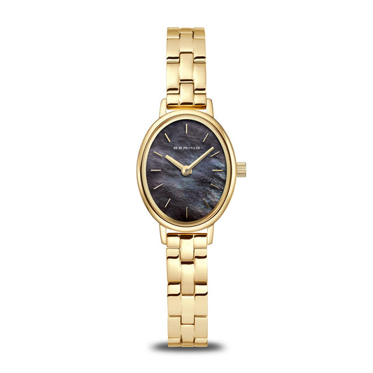 The Bering Watch - Classic Collection - 11020-732 is a gold women’s wristwatch with an oval black face, minimal gold hour markers, a gold link band, and the Bering brand on the dial.