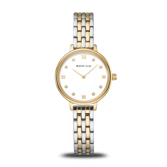 The Bering Watch - Classic Collection 11028-714 is a minimalist women's watch with a round white face, gold bezel, gold Roman numerals, and a two-tone gold and silver stainless steel band for timeless elegance.